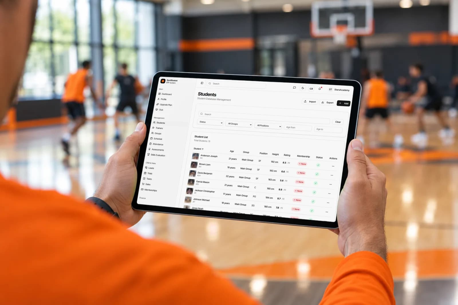 Coach taking attendance at basketball practice with the SpotBasket sports attendance tracking app