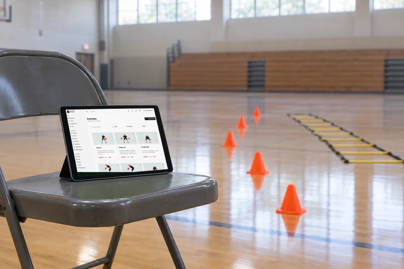 SpotBasket basketball drill library open on a tablet during a youth basketball practice