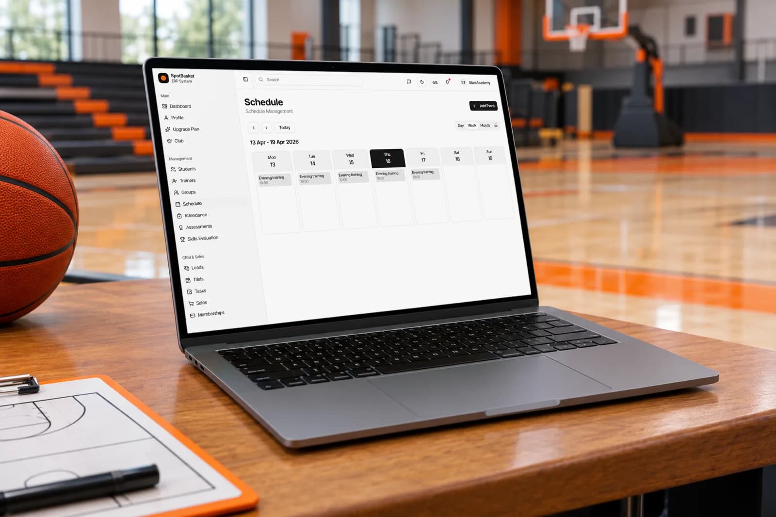 SpotBasket basketball team scheduling app showing a weekly practice calendar on a laptop