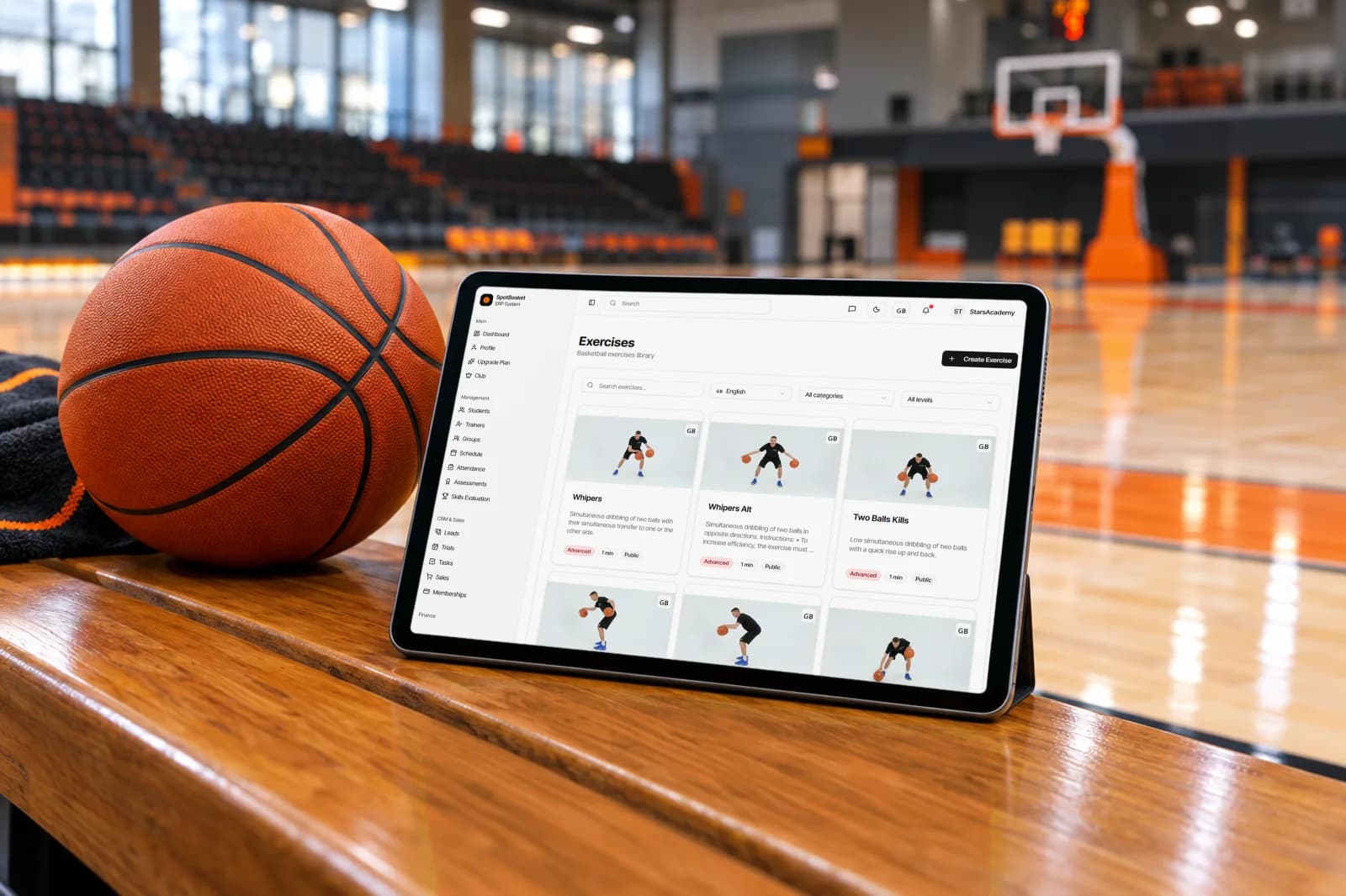 SpotBasket basketball drill library open on a tablet during a youth basketball practice